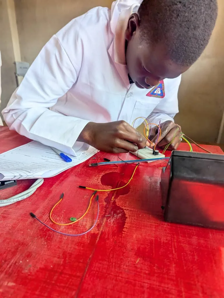 A Successvale learner working with an electronics circuit